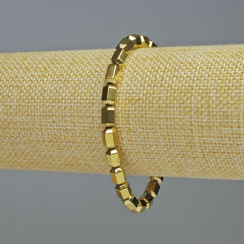 Pulsera de hematita dorada con hexágonos