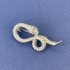 Broche-colgante «Serpiente» color plata con cristales blancos, metal plateado 44x20 mm +