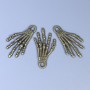 Colgante accesorio Mano de esqueleto, color bronce, dimensiones 35x19x2 mm ±, agujero diámetro 3 mm ±, empaque de 20 g (~ 9 uds.)