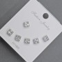 Aretes tipo botón plateados con cristales blancos de 5 mm ±