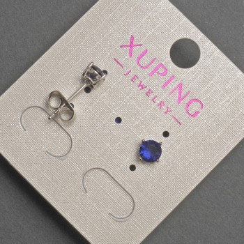 Aretes tipo botón Xuping con cristal azul, diámetro ~5 mm, baño de rodio