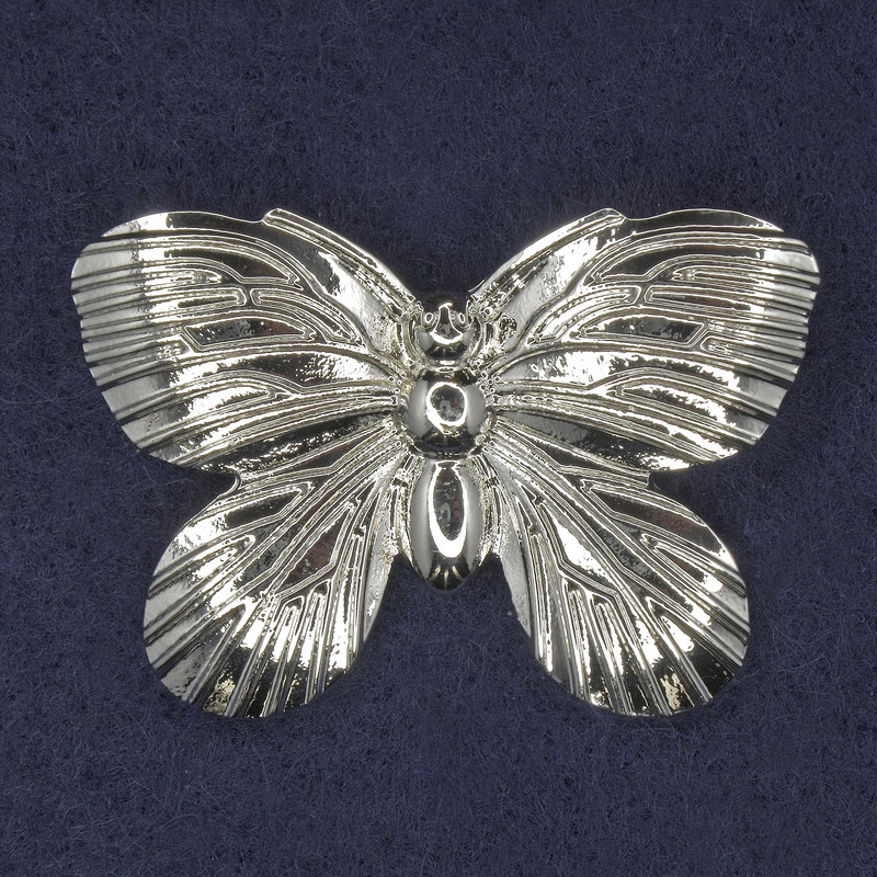 Broche mariposa de metal plateado 42×30 mm