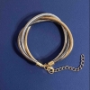 Pulsera triple de metales dorado, plateado y gris con cadena extensible