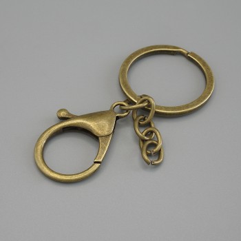 Precio por paquete /10 piezas. Base para llavero con dos enganches: mosquetón 33×24 mm y anilla, diámetro 3 cm, longitud 7 cm