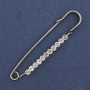 Broche-alfiler con strass blancos 60×12 mm ± metal plateado
