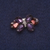 Broche «Lazo» con cristales, metal plateado 17×30 mm