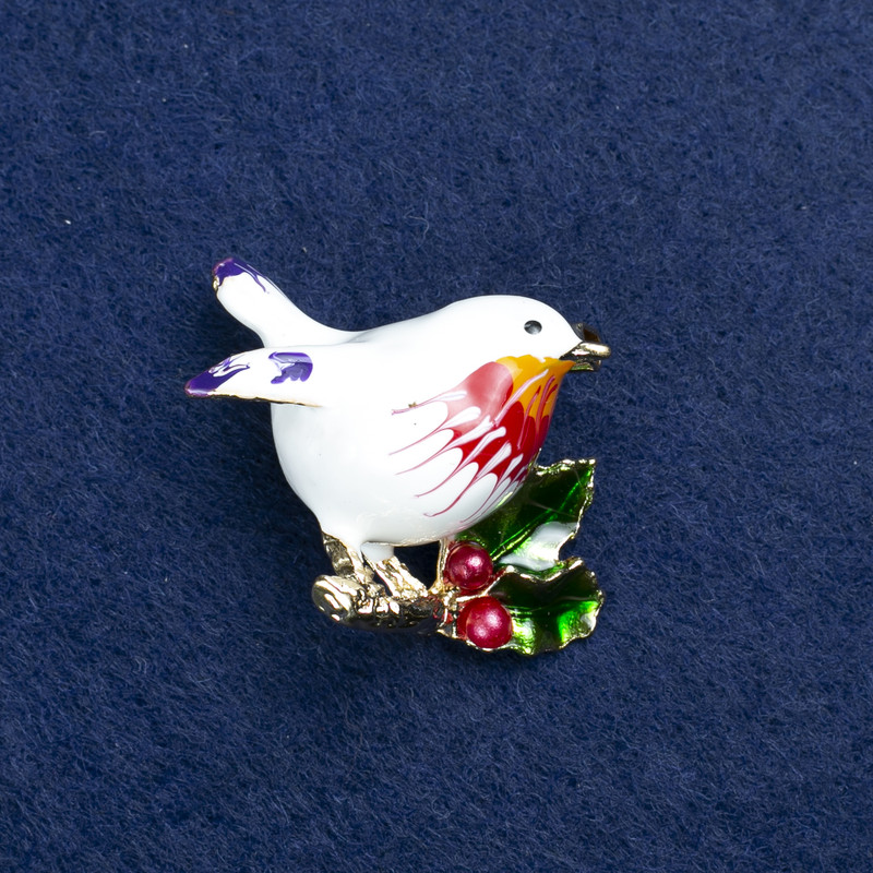 Broche «Pájaro» de metal dorado y esmalte