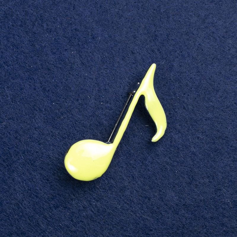Broche 'Nota' de metal plateado y esmalte 25×45 mm +