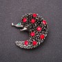 Broche con strass rojos 42x42 mm, metal amarillo