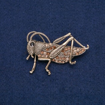 Broche Saltamontes dorado con strass negros y amarillos 57×38 mm +