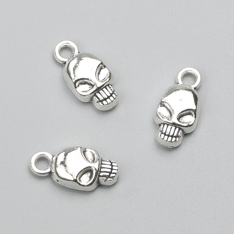 Colgante Calavera 15×7 mm, envase 20 uds ±, 20 g