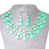 Conjunto de collar y pendientes Lava-Lámpara, metal dorado y brillo aguamarina